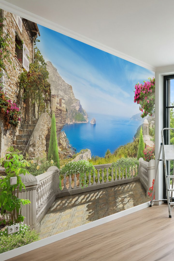 Dreamwall Taş Korkuluklu Teras, Pembe Çiçekler ve Sahil Kasabası Manzaralı Tek Parça Tekstil Duvar K...